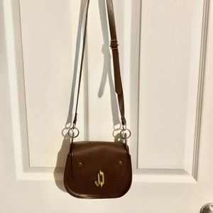 Brand new handbag. Brown. Snap closure.